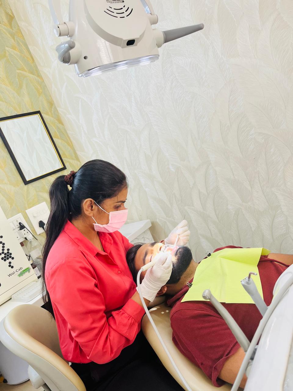 Dr. Shivika performing a dental procedure — clinical expertise at Dental Vedaa